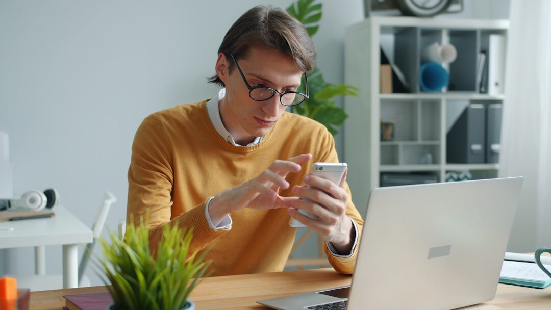 A man working on a coding project in a home office