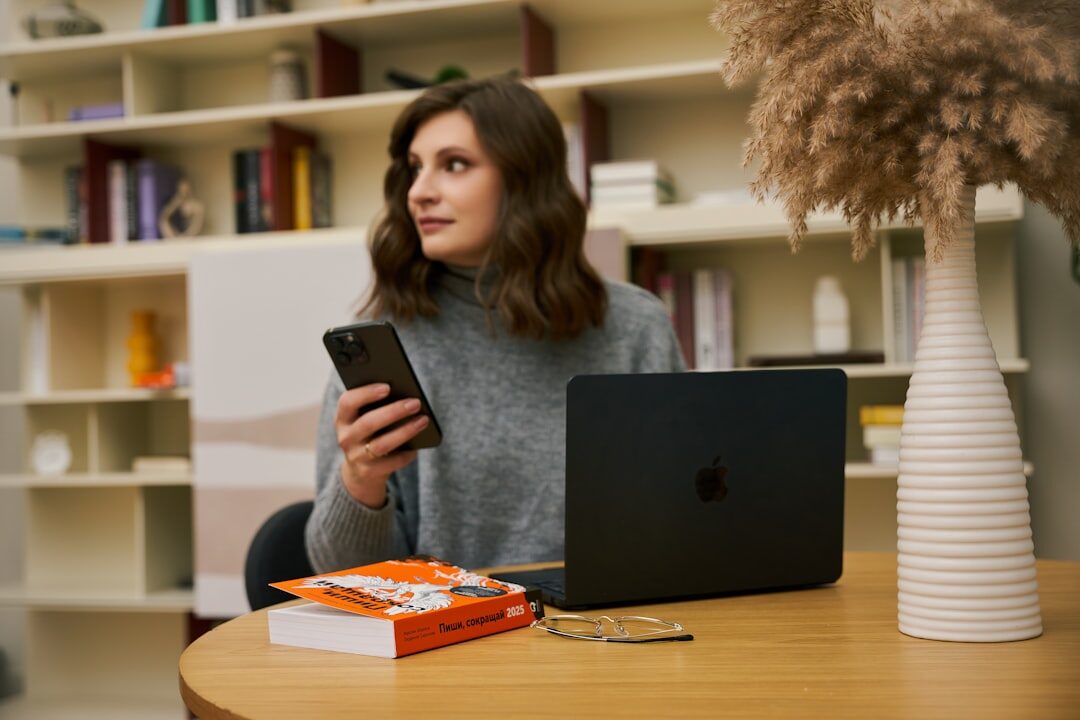 A young woman studying with a laptop in a library