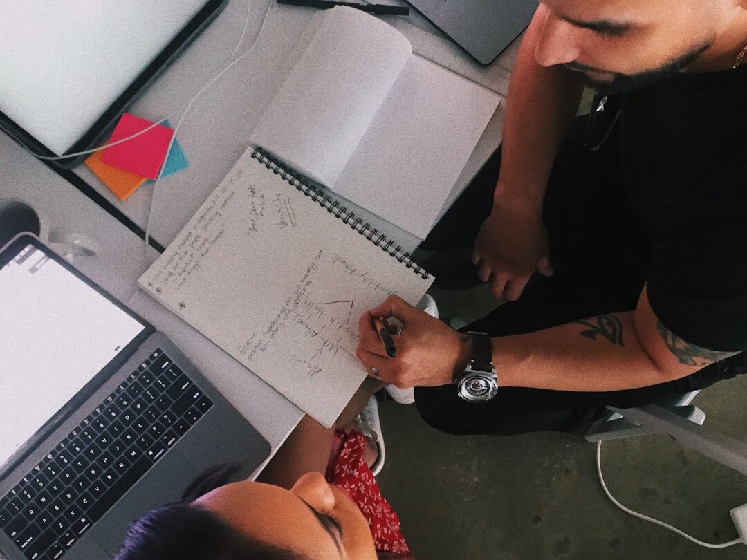 Developer working on AI project with MacBook