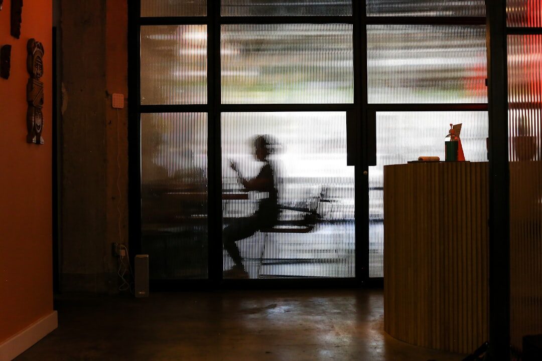 developer working on laptop in coffee shop