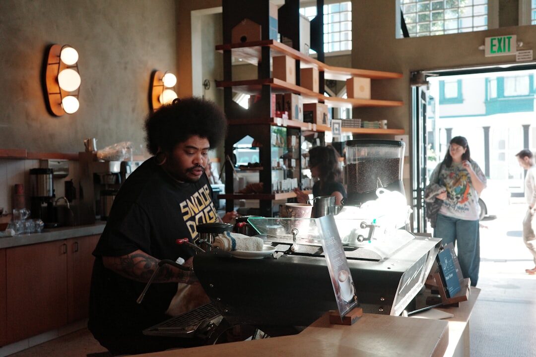 developer working on laptop in coffee shop