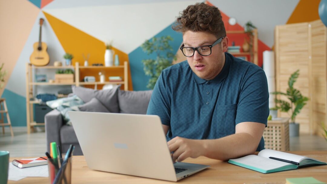 man analyzing data on a computer screen