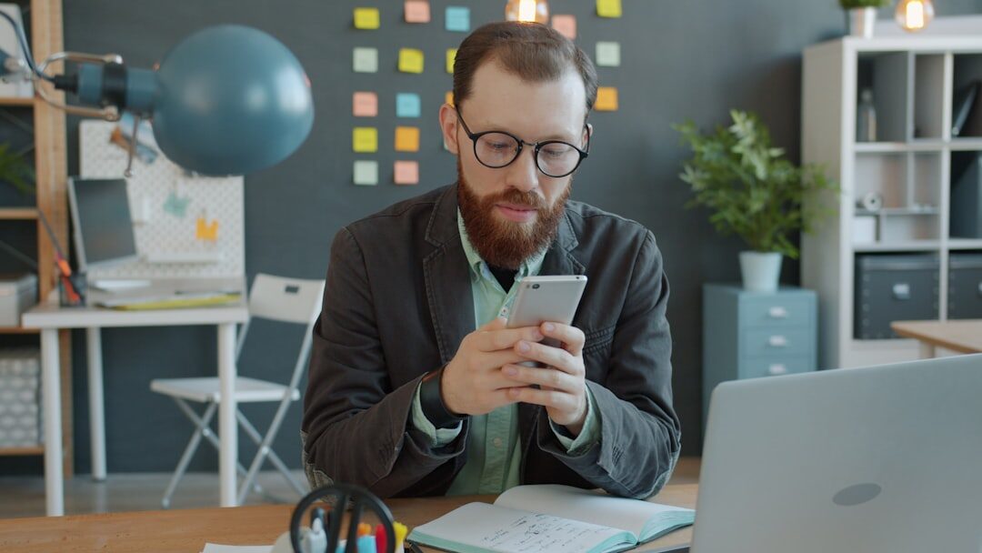 man comparing devices