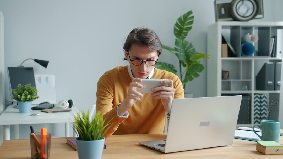 man looking at financial reports on tablet