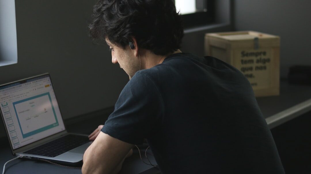 man working on computer in modern office