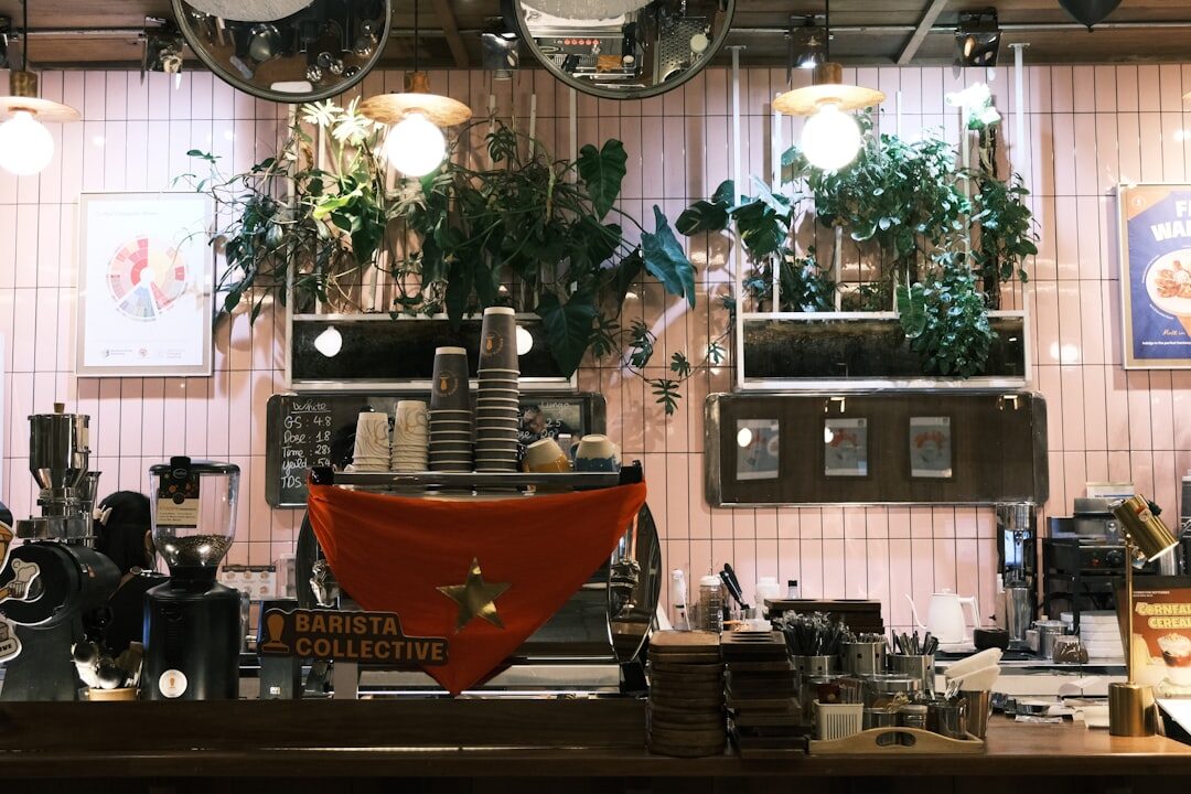 man working on laptop in coffee shop