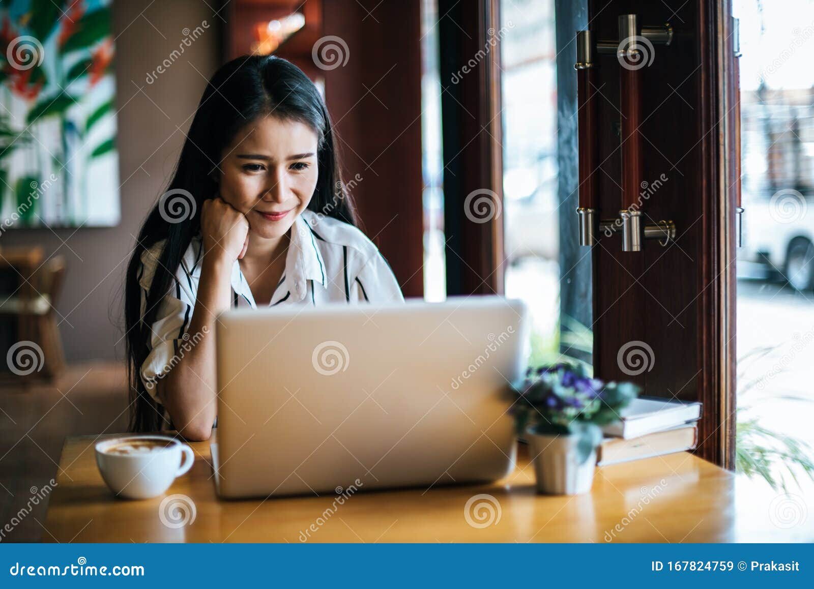 managed WordPress hosting provider working on laptop