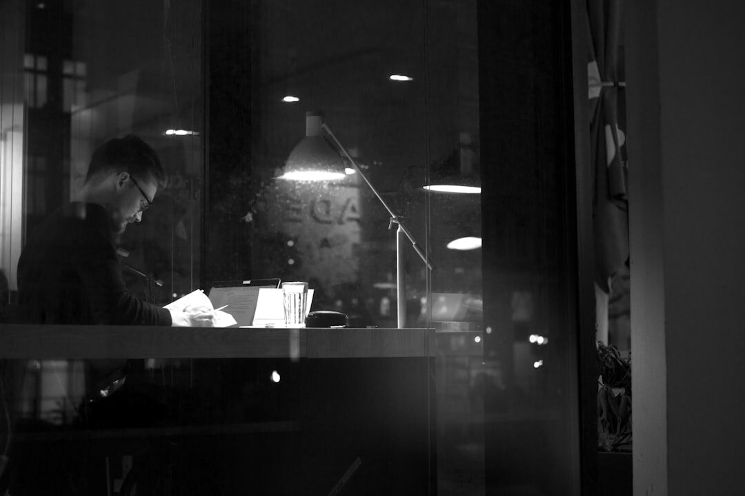 programmer working on code in a busy cafe