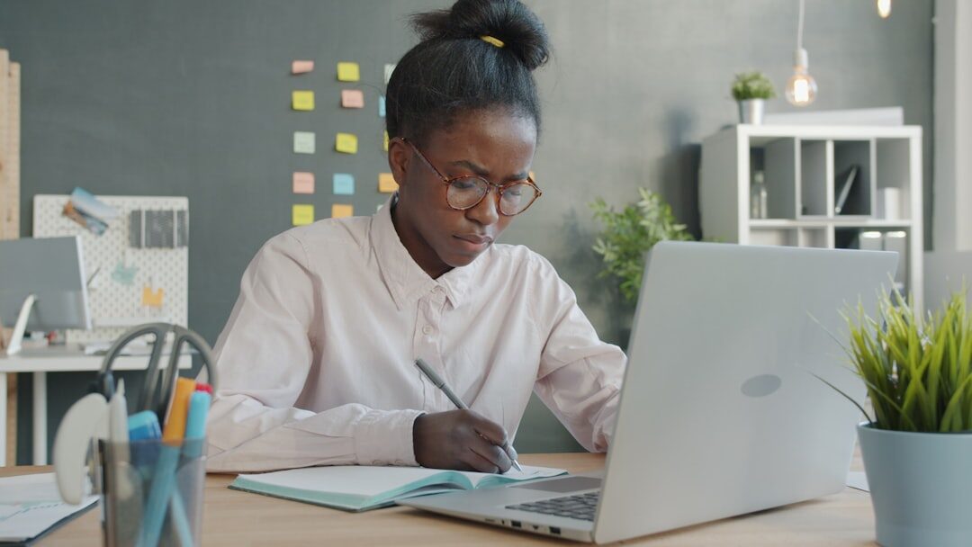 woman coding on laptop