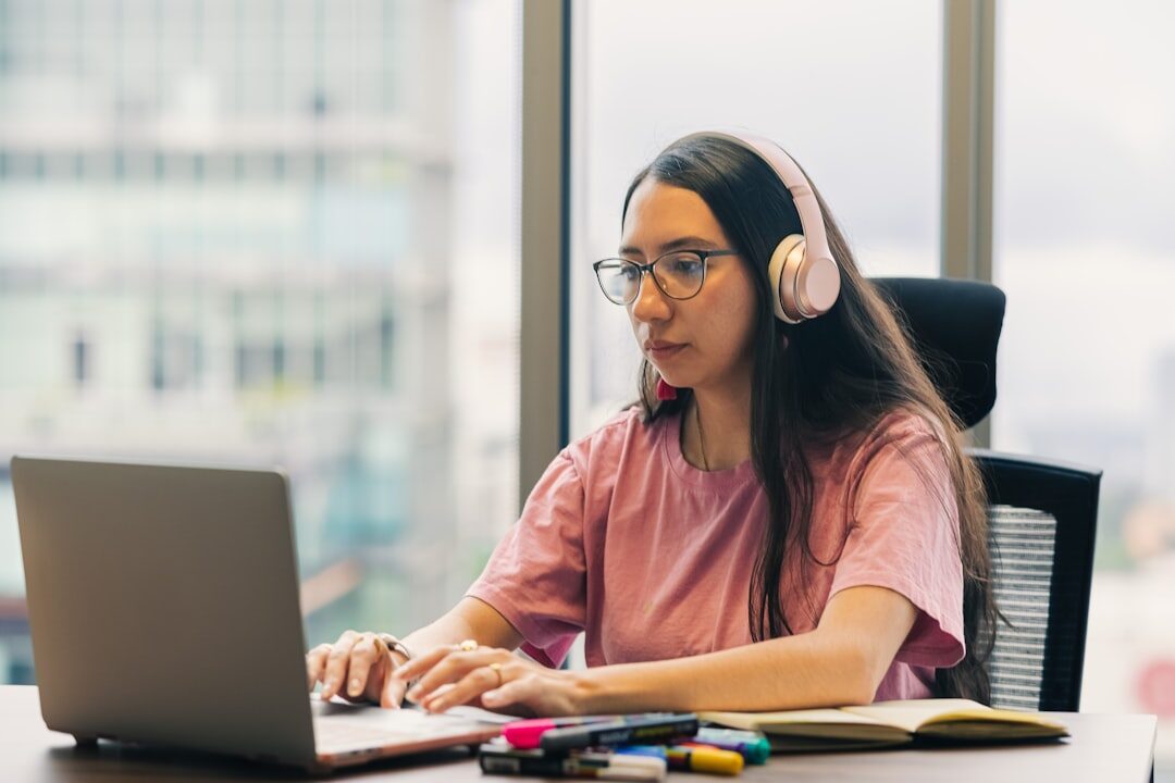 woman coding on laptop