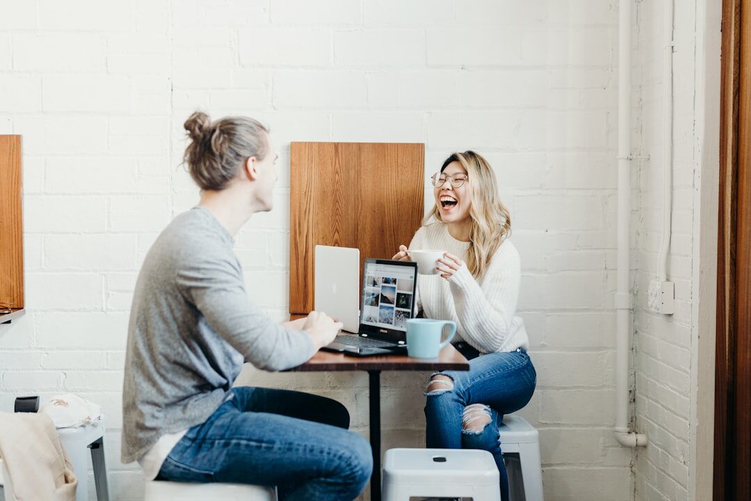 woman comparing benchmarks on dual monitors
