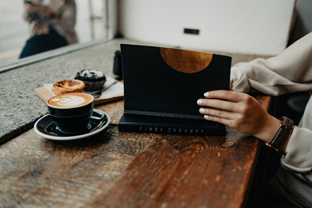 woman working on laptop in coffee shop