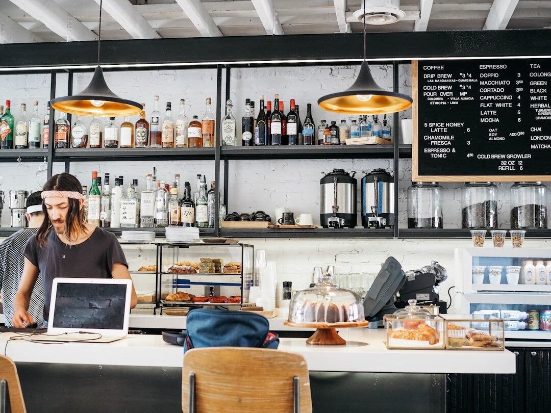 woman working on laptop in coffee shop
