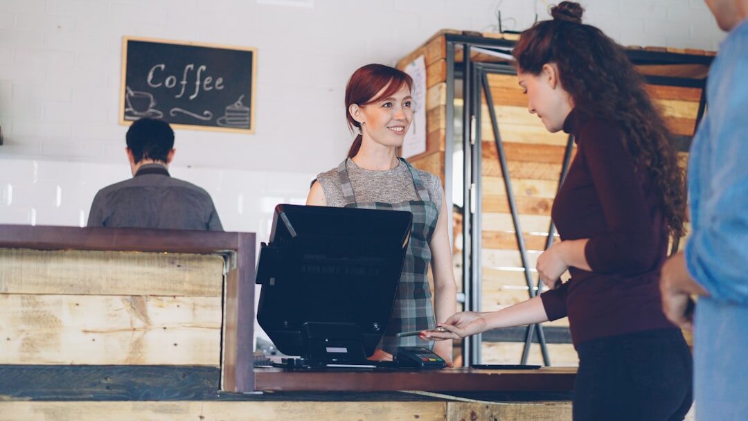 woman working on laptop in coffee shop