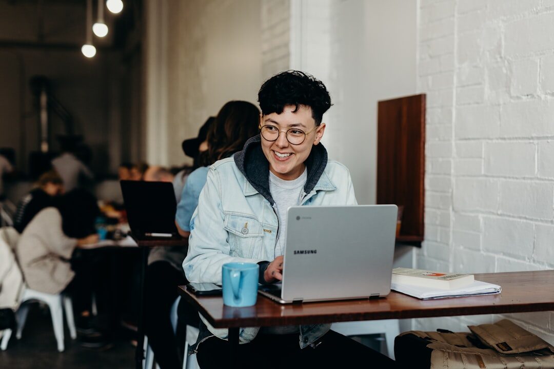 woman working on laptop in coffee shop