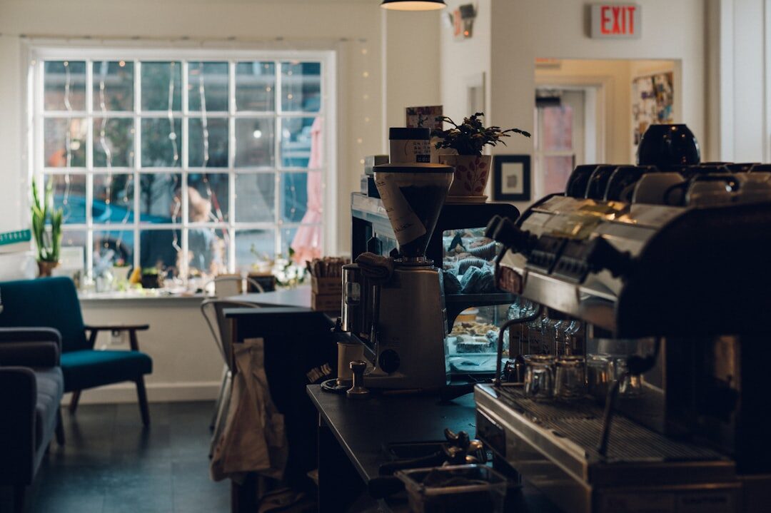 woman working on laptop in coffee shop