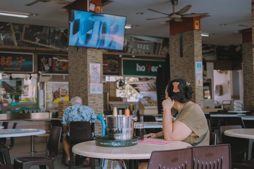 woman working on laptop in coffee shop