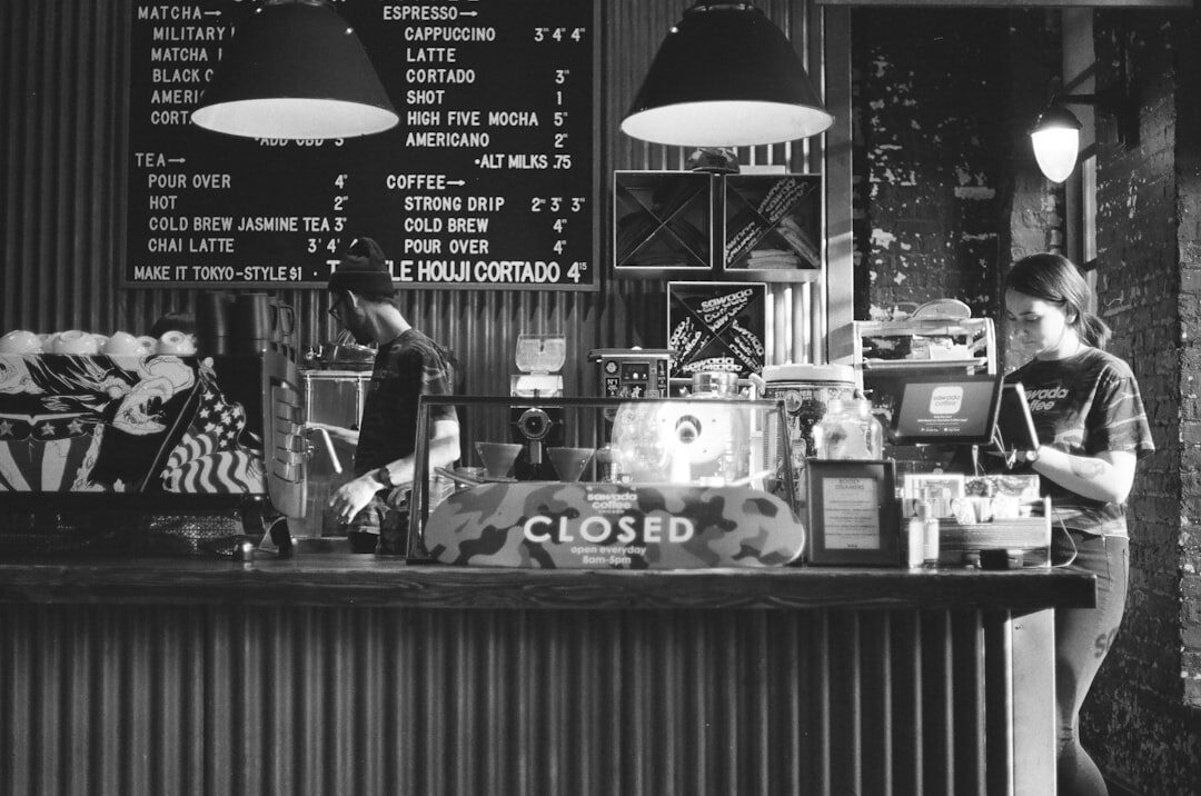 woman working on laptop in coffee shop