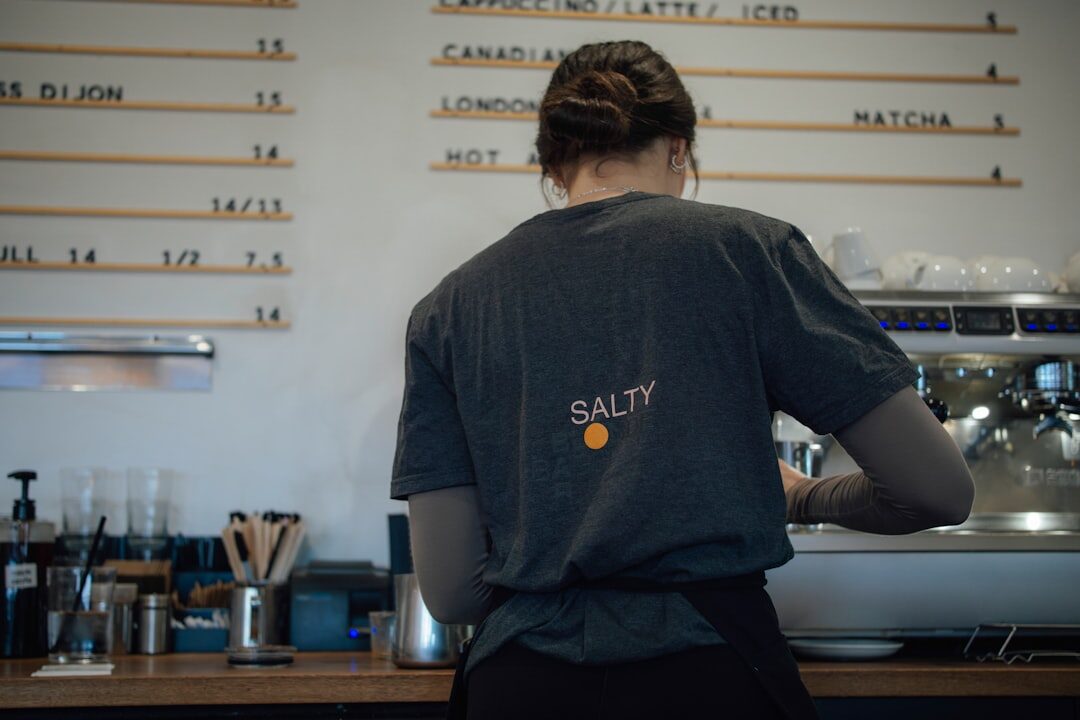 woman working on laptop in coffee shop