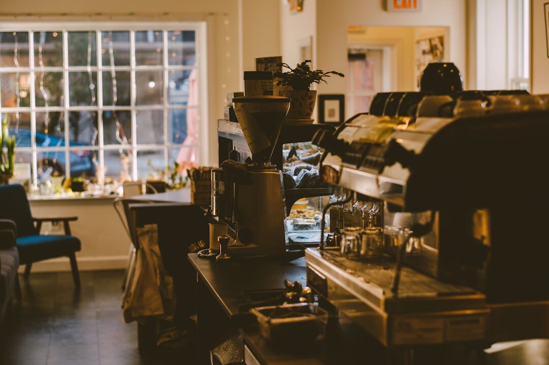 woman working on laptop in coffee shop
