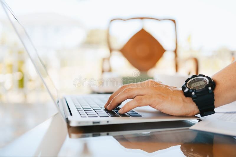 developer working on laptop in coffee shop